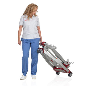 Woman carrying Etac | Molift Smart 150 Folding Mobile Patient Hoist