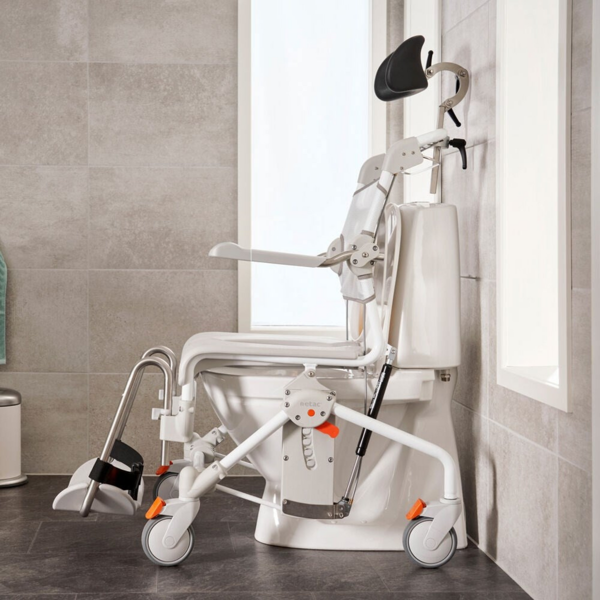 Etac | Swift Mobil Tilt-2 Comfortable and Safe Shower Commode Chair for Carer and User Unique Tilt Function setting view