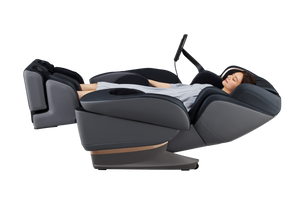 Black and grey Fujiiryoki JP-3000 Zero Gravity Massage Chair. Advanced 5D AI+ Full Body Massage Experience. Woman reclining
