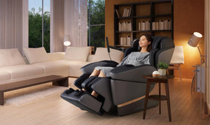 Black and grey Fujiiryoki JP-3000 Zero Gravity Massage Chair. Advanced 5D AI+ Full Body Massage Experience. Woman using in living room