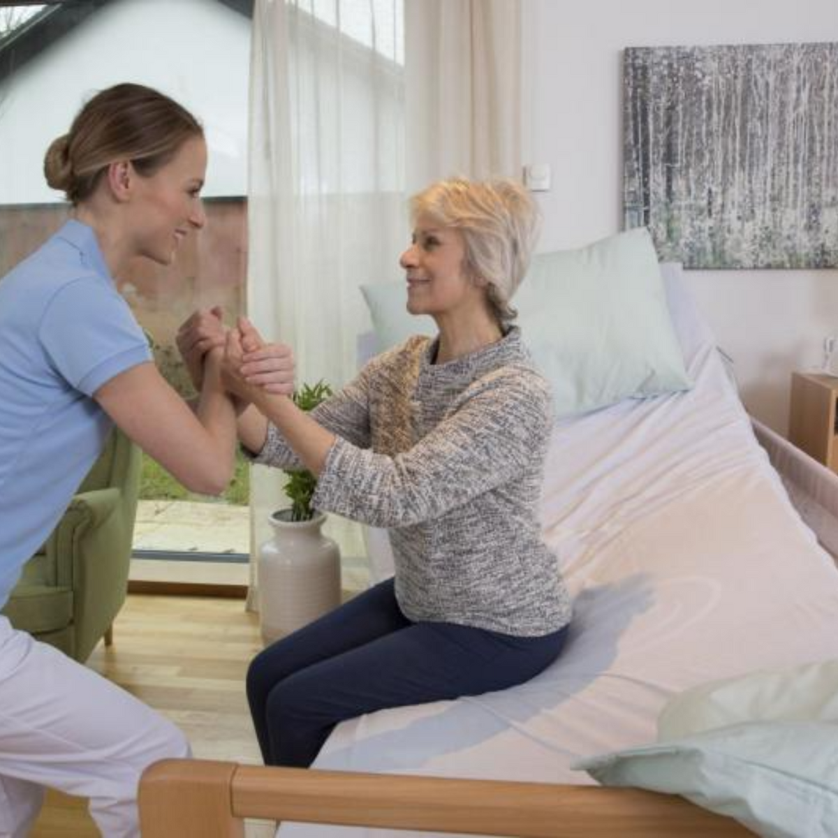 Invacare | Soft Tilt Automated and Manual Patient Repositioning for Enhanced Comfort and Care patient woman using