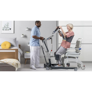 Woman using the Invacare | Stand Assist (ISA) 160kg Patient Lifter | Efficient Transfers |  Fall Prevention and Lift Aid with a nurse