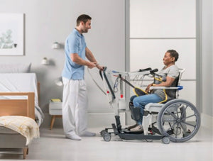 invacare stand assist isa patient lifter in use patient lifted to a wheelchair