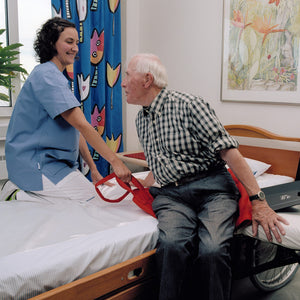 Senior Patient Being Transferred from Wheelchair to Bed Using Direct Healthcare Group MoveMaster  Sliding Mat