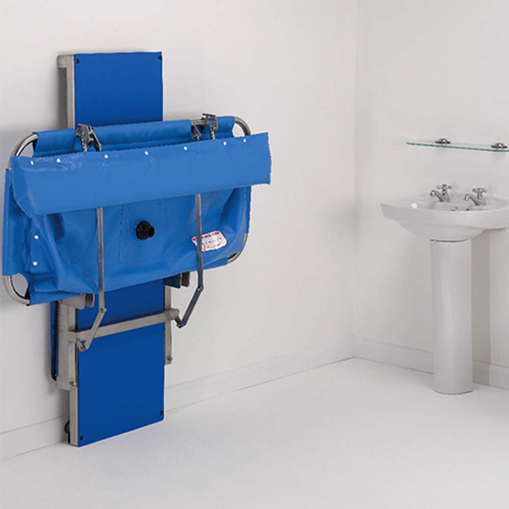 Prism Medical | Freeway Hi-Riser Shower Stretcher folded against wall