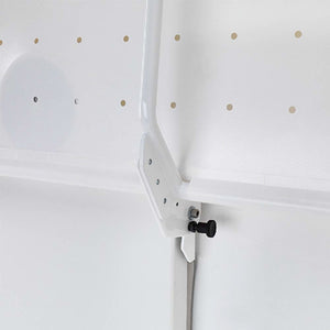 Prism Medical | Freeway Manual Height Adjustable Shower Stretcher folded against wall 