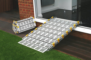 Roll-a-ramp portable and foldable disabled wheelchair ramp over door threshold