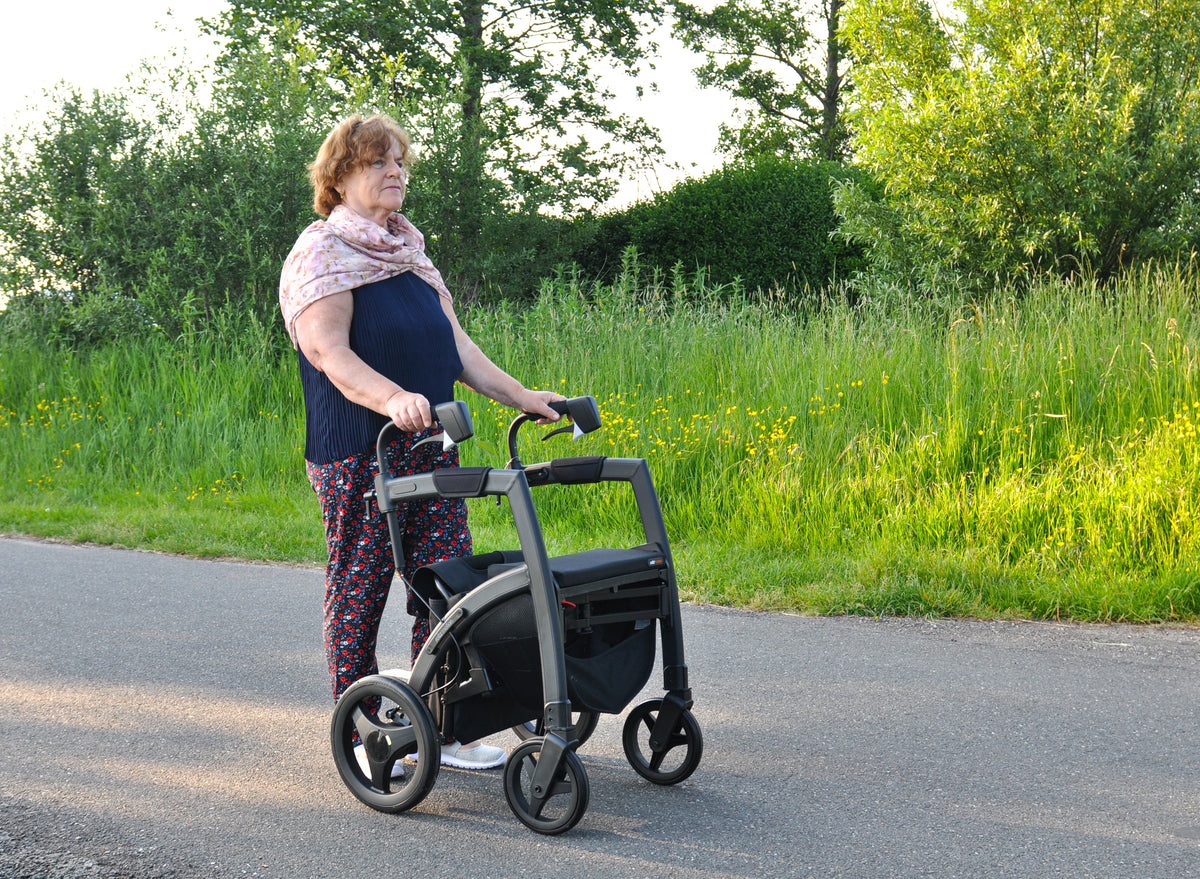 rollz motion rhythm rollator and wheelchair being used outdoors 1