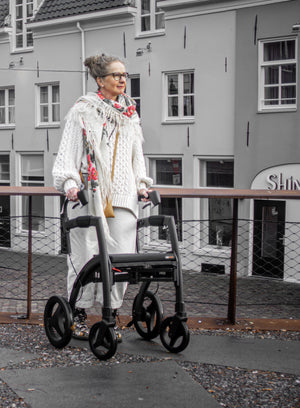 rollz motion rhythm rollator and wheelchair being used outdoors