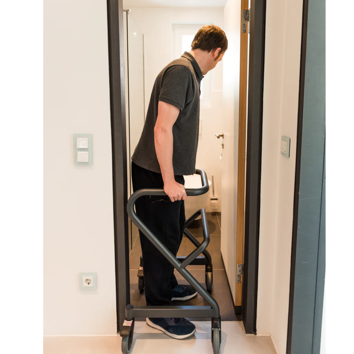 Rollz | Saljol Page Indoor Rollator Stable Mobility with Swivel Wheels and Customizable Features for Indoor Comfort man walking