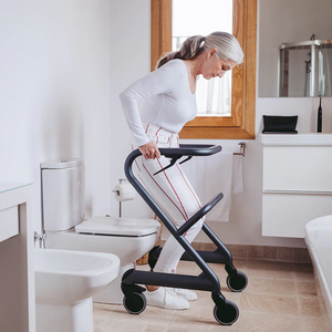 Rollz | Saljol Page Indoor Rollator Stable Mobility with Swivel Wheels and Customizable Features for Indoor Comfort woman using in bathroom
