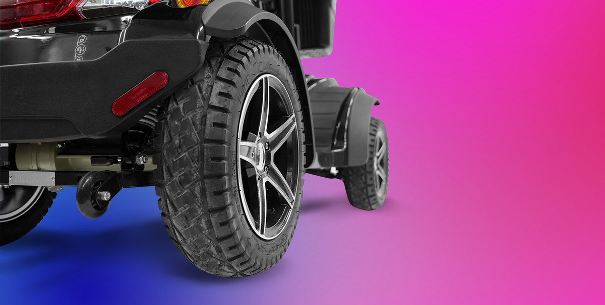 Scooterpac Ignite Grande 8 mph Mobility Scooter Extra Storage, Comfort, and Safety for Ultimate Mobility Ultimate Personal Mobility Solution close up of rear wheel