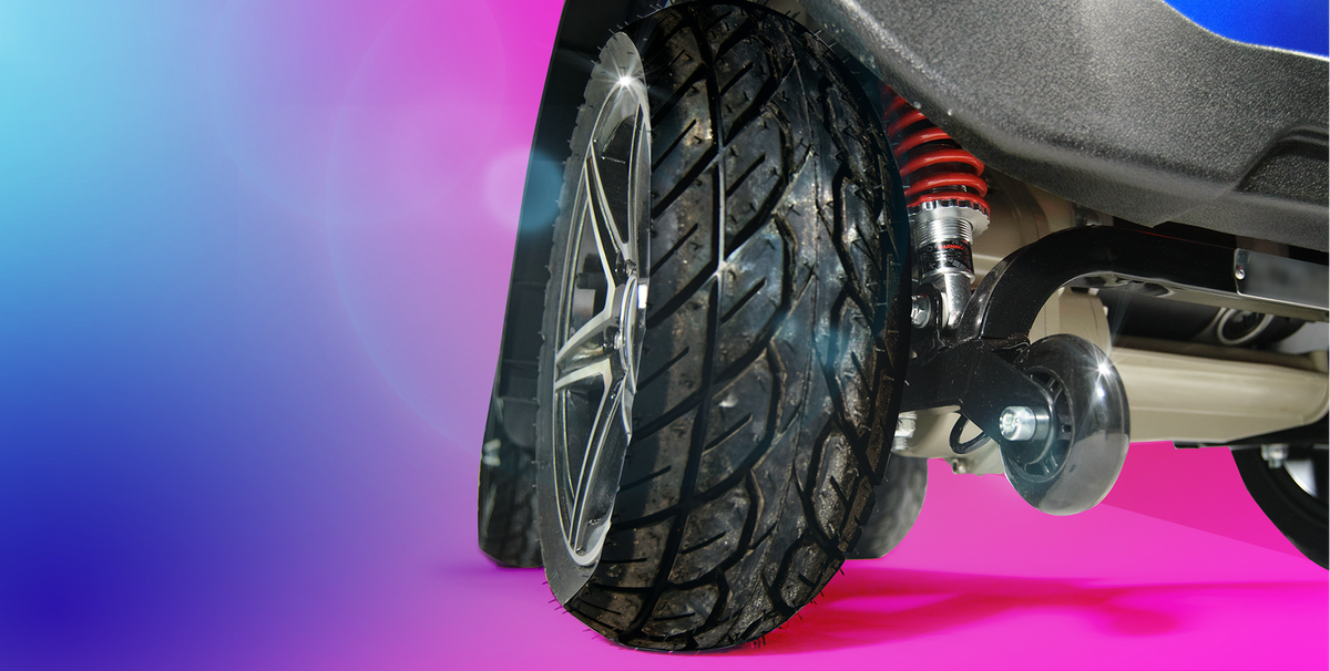 Blue Scooterpac Ignite Mini 8 MPH Electric Mobility Scooter. 35 Mile Range. Heated Seat. Compact Personal Mobility Solution close up of tyre