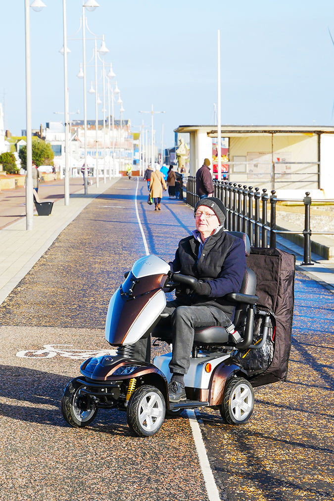 Scooterpac Universal Foldaway mobility scooter Canopy. automated Rain protection attached to the back of a mobility scooter