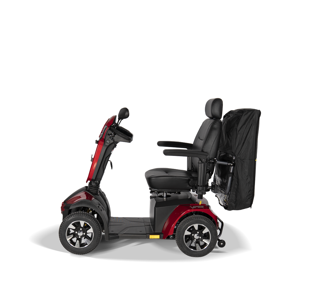 side view of a retractedScooterpac Universal Foldaway mobility scooter Canopy. automated Rain protection conected to the back of a mobility scooter
