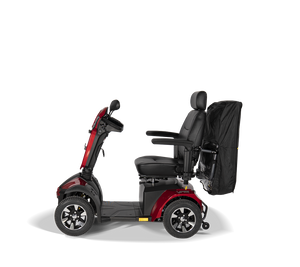 side view of a retractedScooterpac Universal Foldaway mobility scooter Canopy. automated Rain protection conected to the back of a mobility scooter